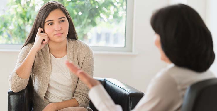 Woman speaking with a psychologist