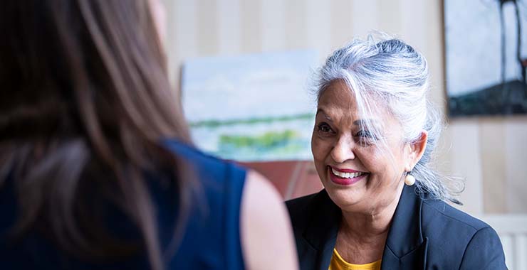 Older female adult in a business meeting