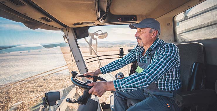 Farmer driving a tractor
