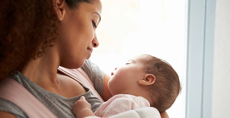 Mother holding her infant child