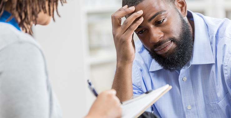 Man looking stressed over medical bill