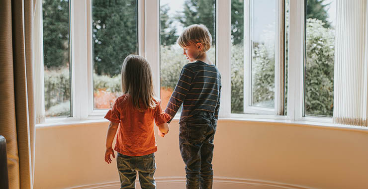 two young children holding hands