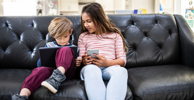 Young boy and girl looking at a tablet