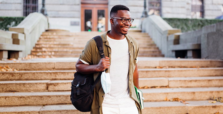 Student walking with his backpack