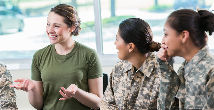 Military women in uniform talking amongst one another