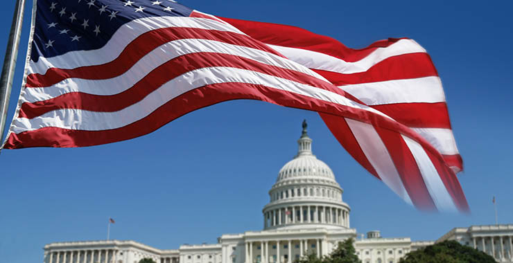 American flag flying in front of U.S Capitol building