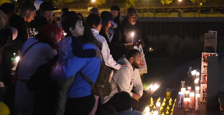 People at a candlelight vigil