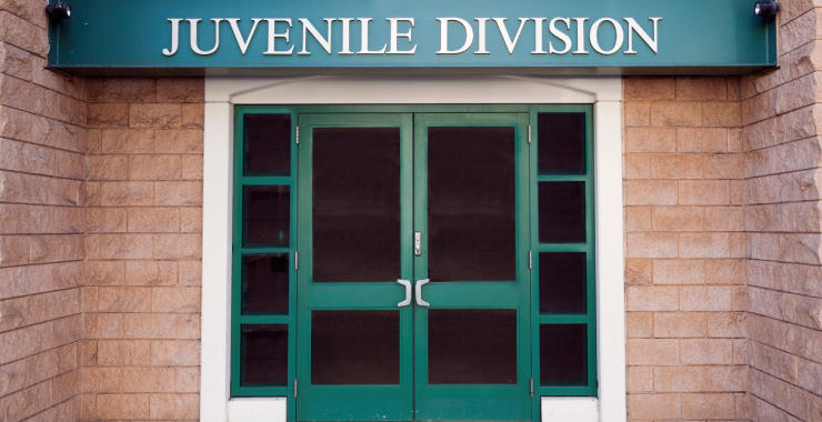 Double door entrance to a juvenile division building.