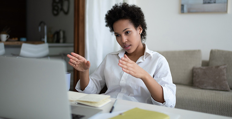 Woman working on laptop from home