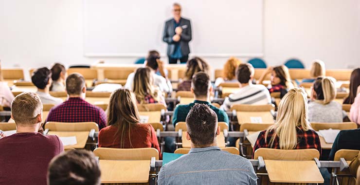 College professor standing in front of students
