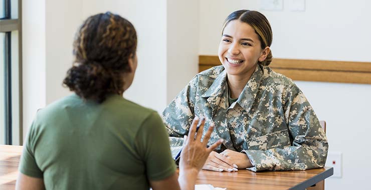 Two military members meeting