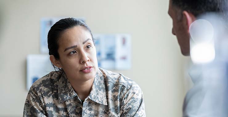 Military veteran speaking with a psychologists