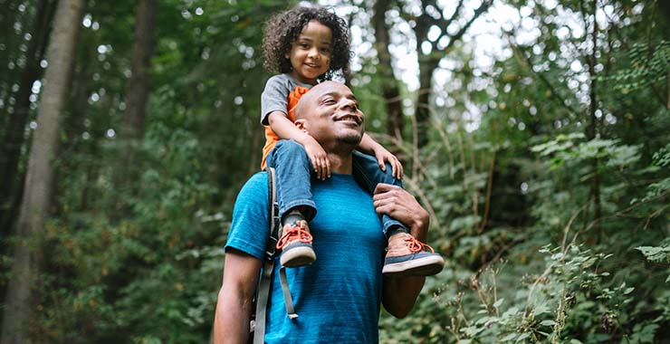 Father hiking with young daughter