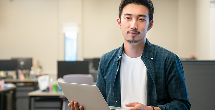 Man holding a laptop