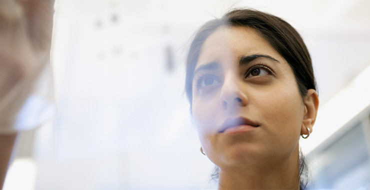 photo of a woman behind a glass