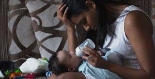 Mother feeding baby