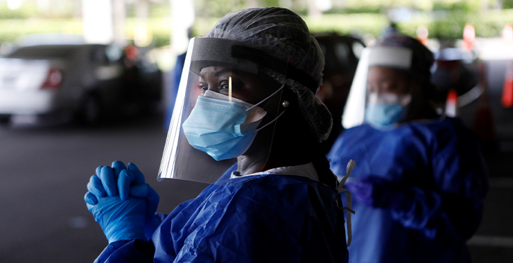 Black medical personnel in full PPE equipment