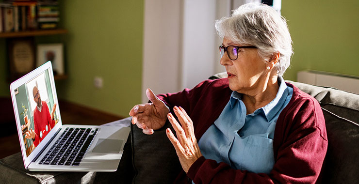 Woman having a telehealth appointment on laptop