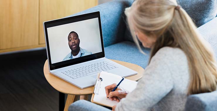 Psychologist on video call with client
