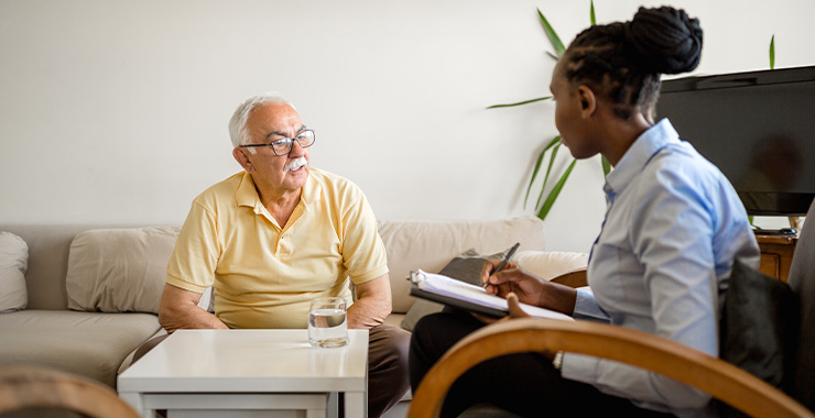 Senior citizen speaking with psychologist