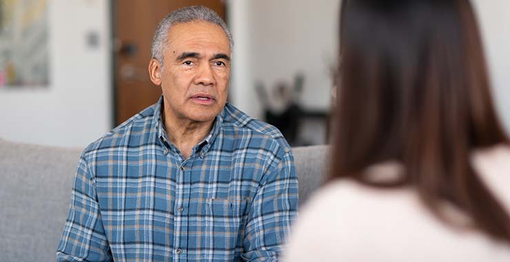 Older adult speaking with psychologist