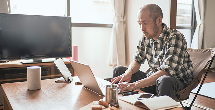 Man at home using a laptop