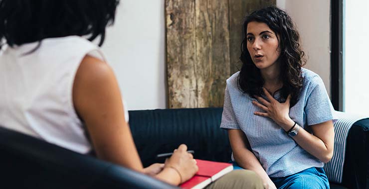 Woman meeting with clinician