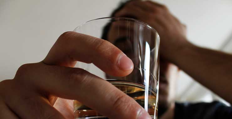Person holding an alcoholic drink
