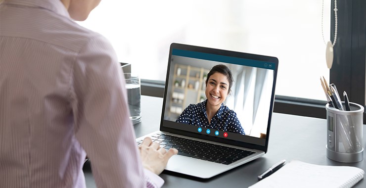 discussion between two women using a laptop