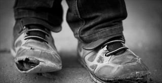 Underprivileged man's shoes 