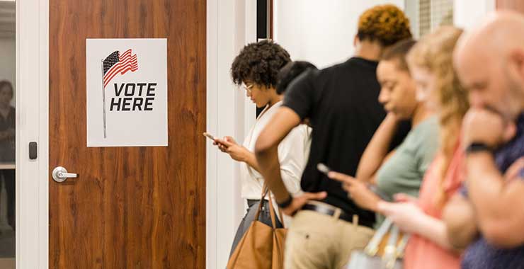 voters waiting in line to cast their ballots