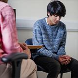 Student talking one on one with a teacher